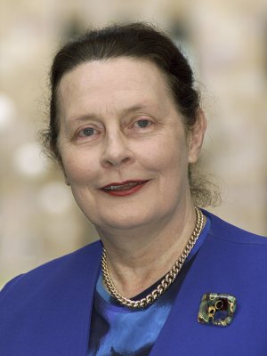 Head shot of a woman in a blue jacket 